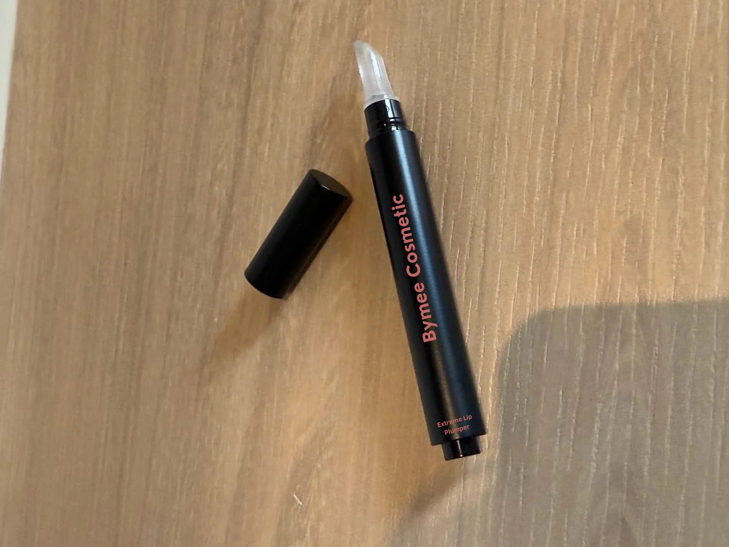 files/bymee-lip-plumper-on-table-flatlay.webp